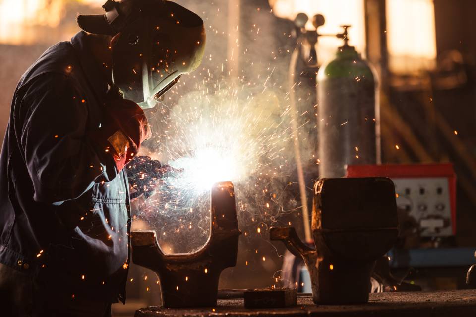 ironsmith with cutting torch