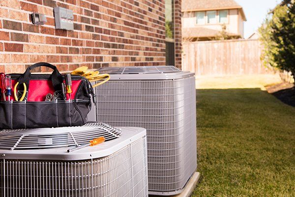 Air Conditioners Outside Residential Home — Killeen, TX — Artie's Heating AC