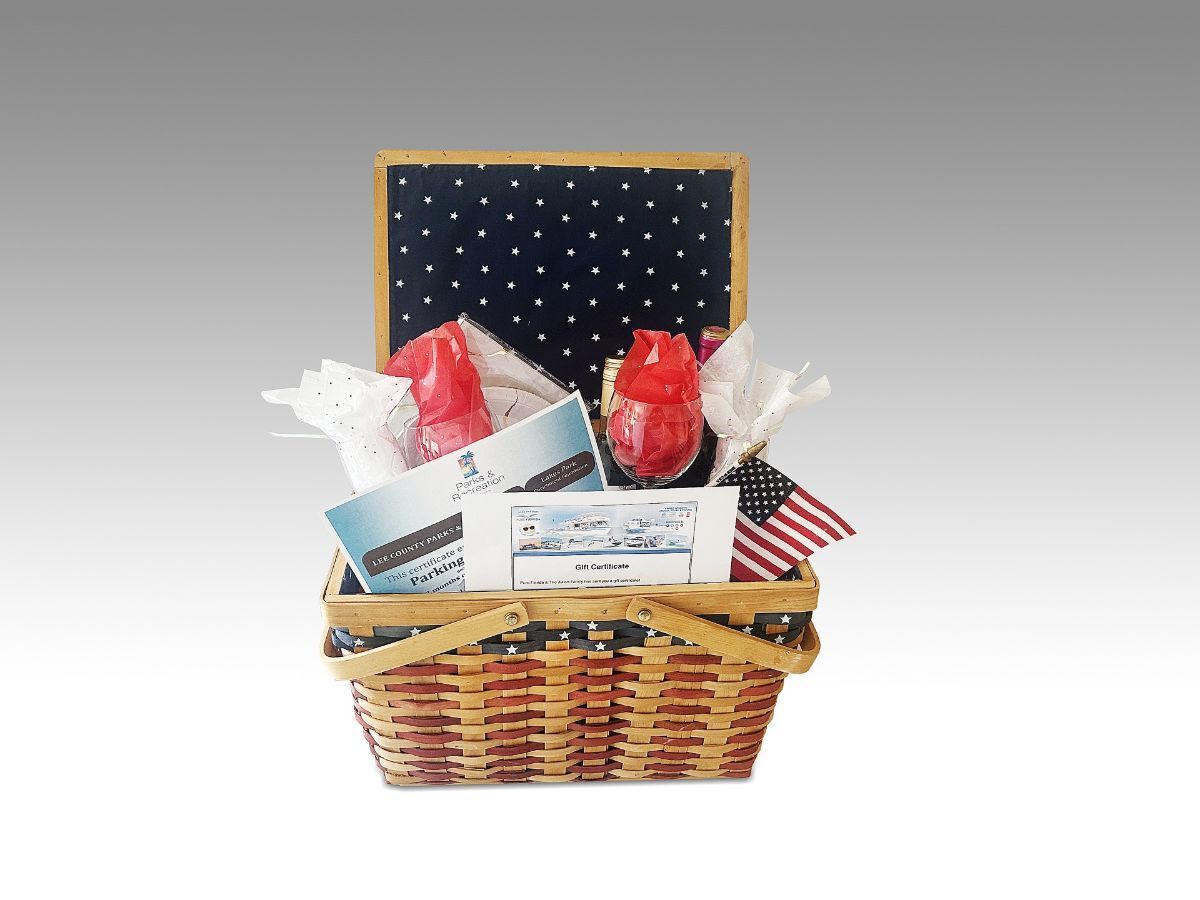 A wicker basket filled with a variety of items on a white background