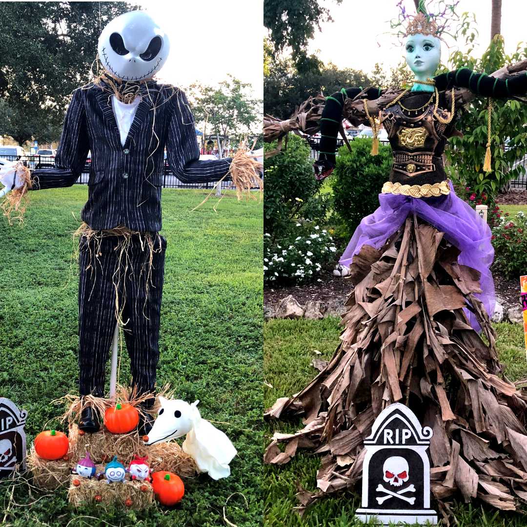 A couple of scarecrows standing next to each other in a field.