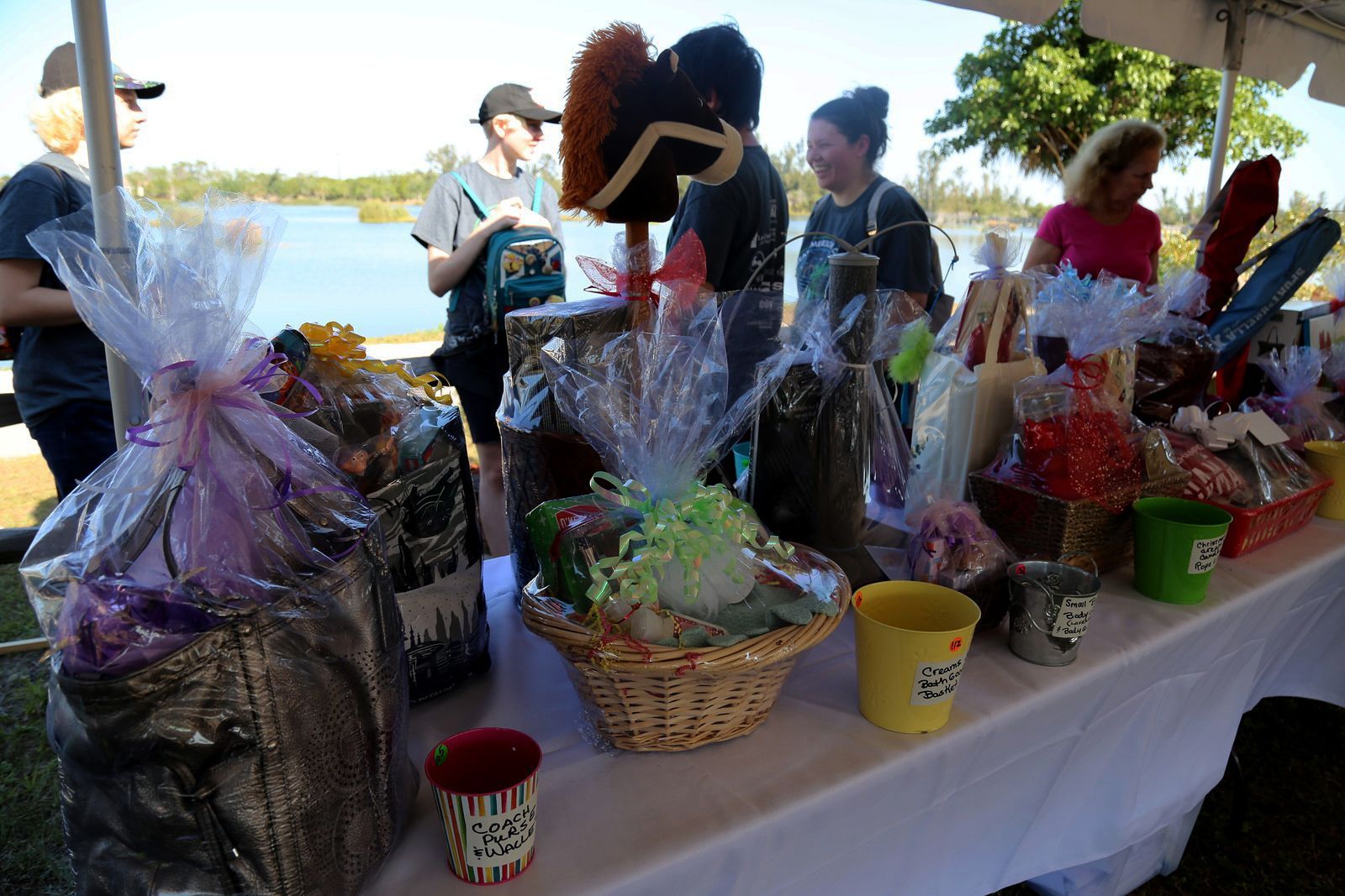 A table with lots of baskets and buckets on it