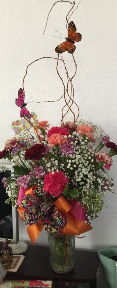 Mother's Day Flowers — Flower Arrangement with Red Flowers and Butterfly Decorations in Houston, TX