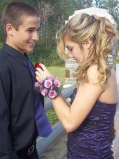 Boutonniere — Young Girl Pinning Flowers Onto Her Date in Houston, TX
