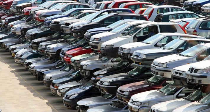 scrap cars lying on top of each other