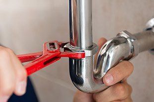 Plumbing — Plumber Fixing Pipe in Tuscaloosa, AL