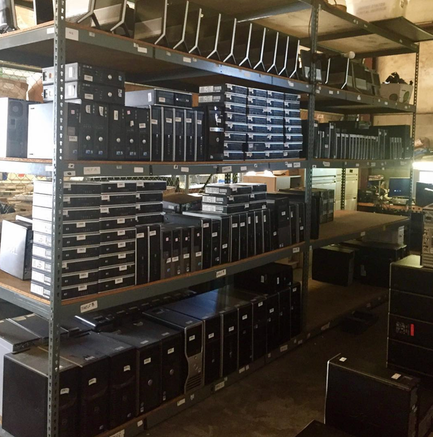 A warehouse filled with lots of computer cases and shelves