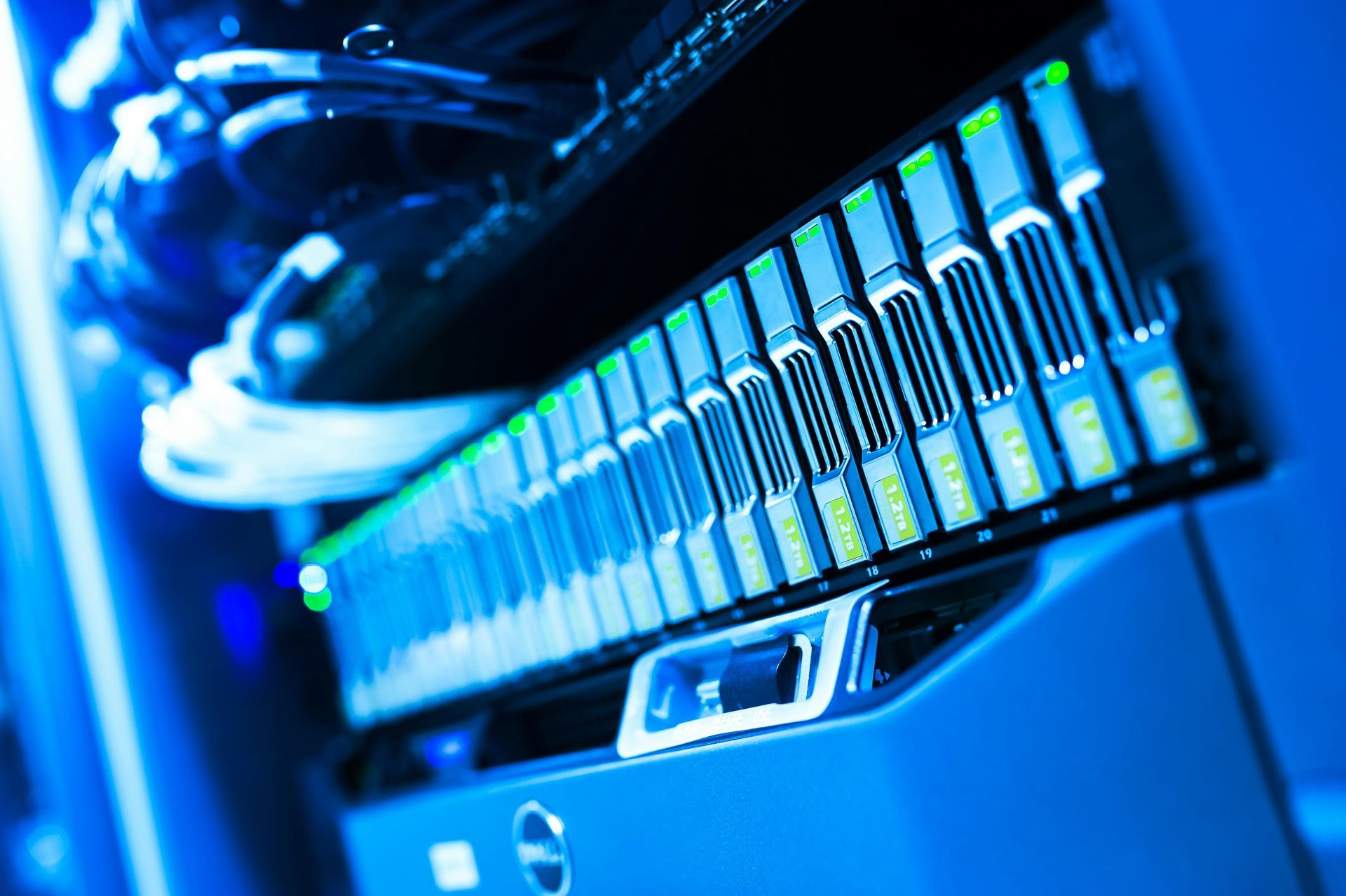 A row of servers are sitting on top of each other in a server room.