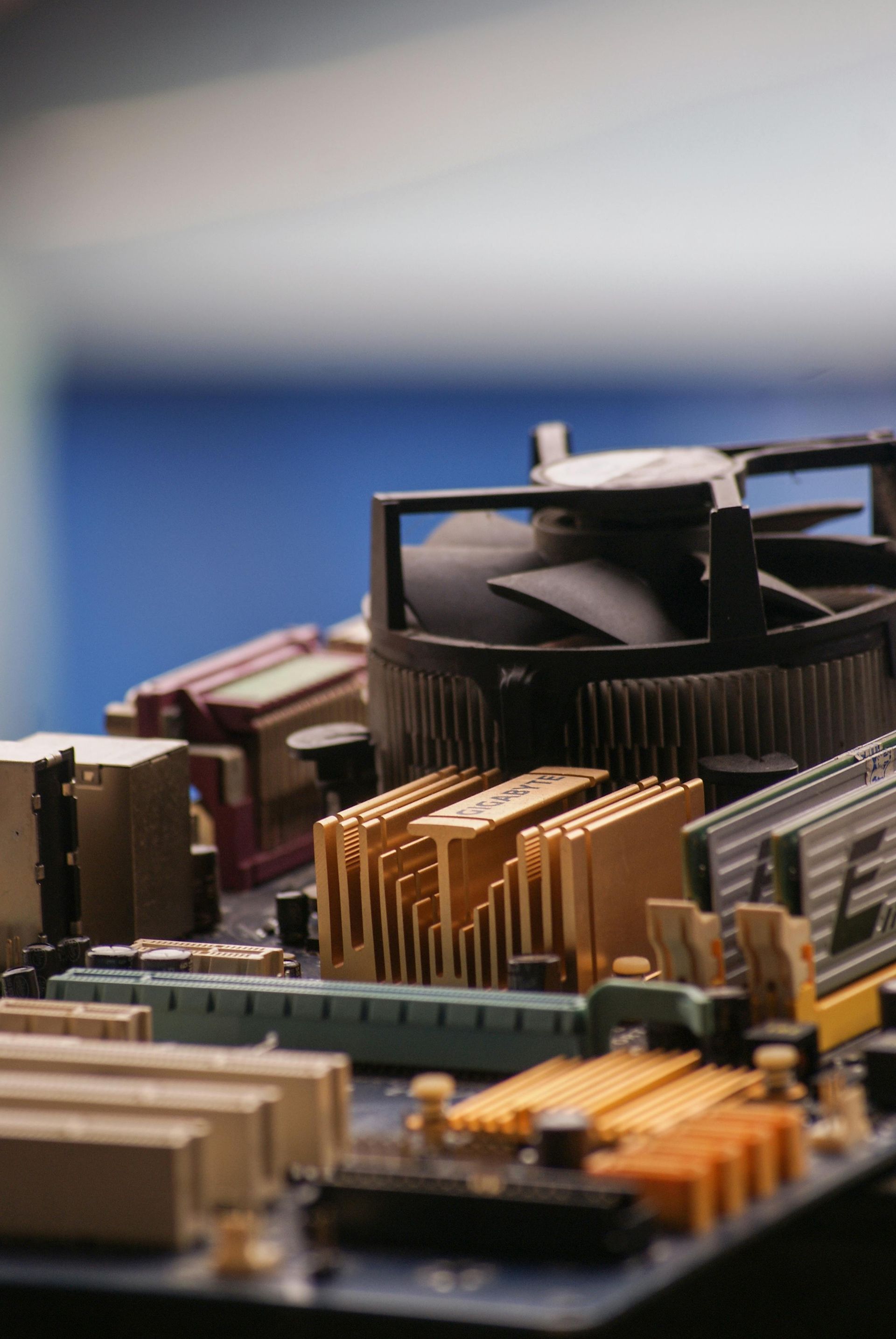 A close up of a motherboard with a fan on it