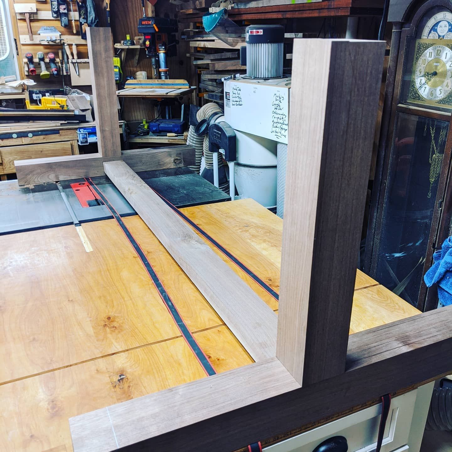 A piece of wood is sitting on a table in a workshop