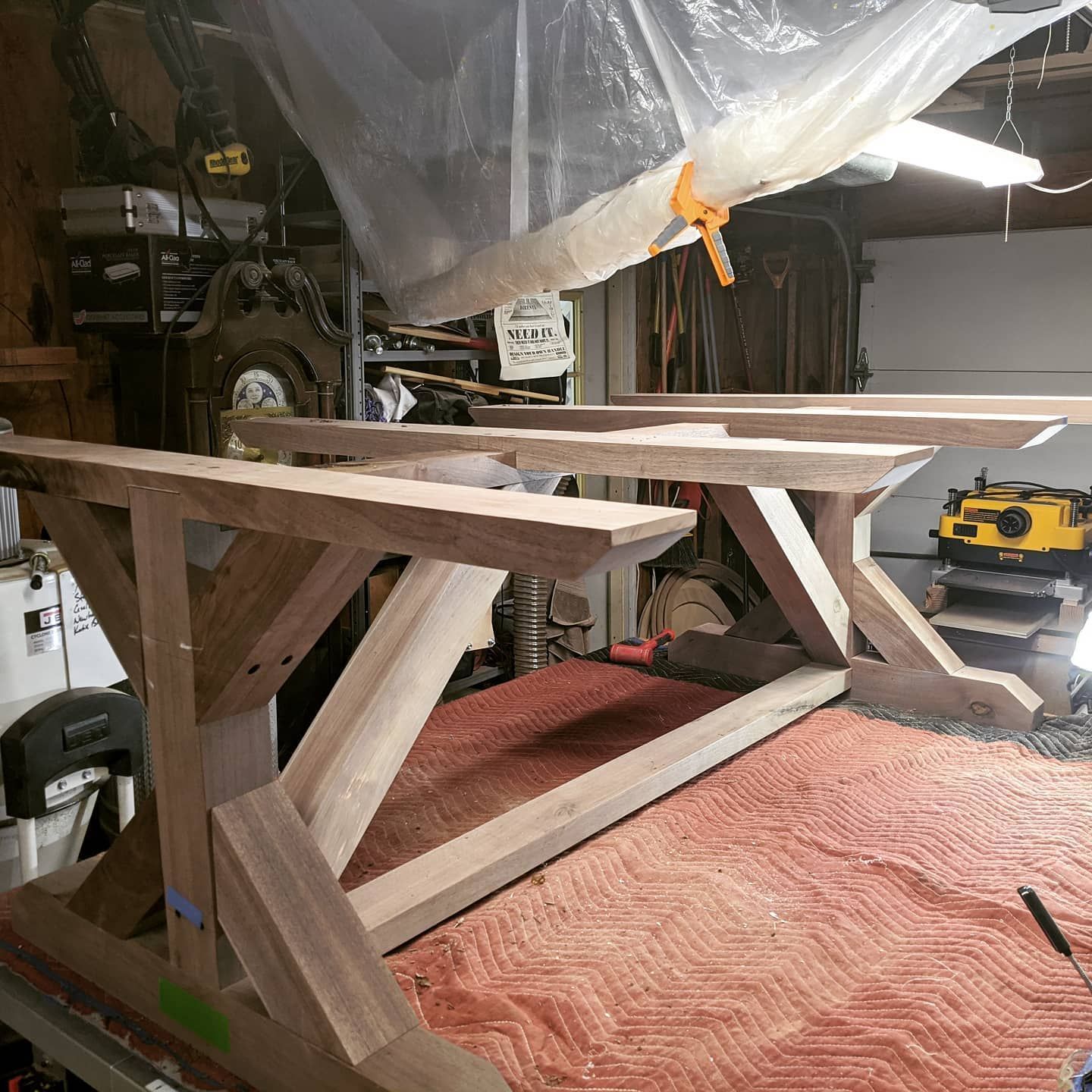 A wooden table is being built in a garage