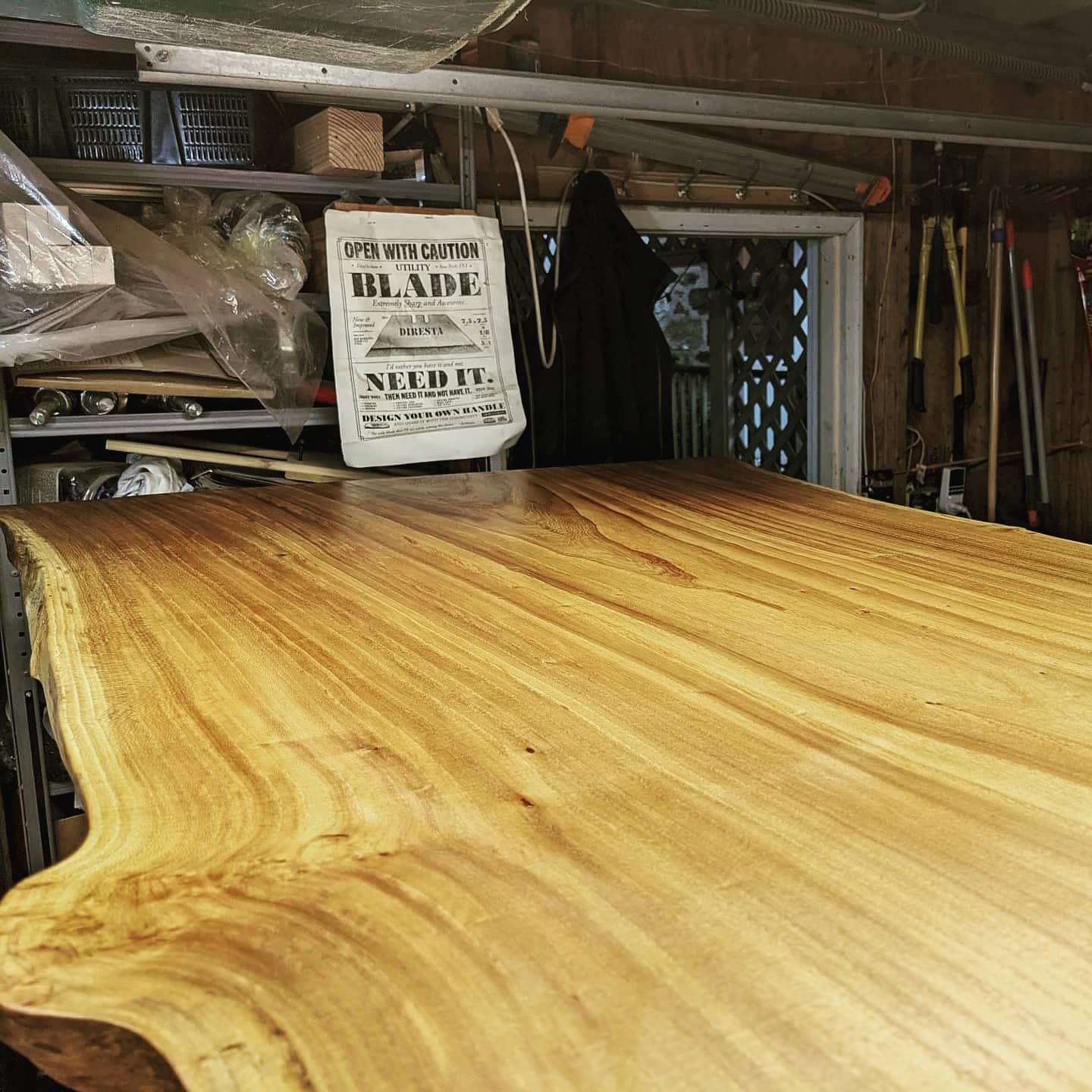 A wooden table with a sign that says blade on it