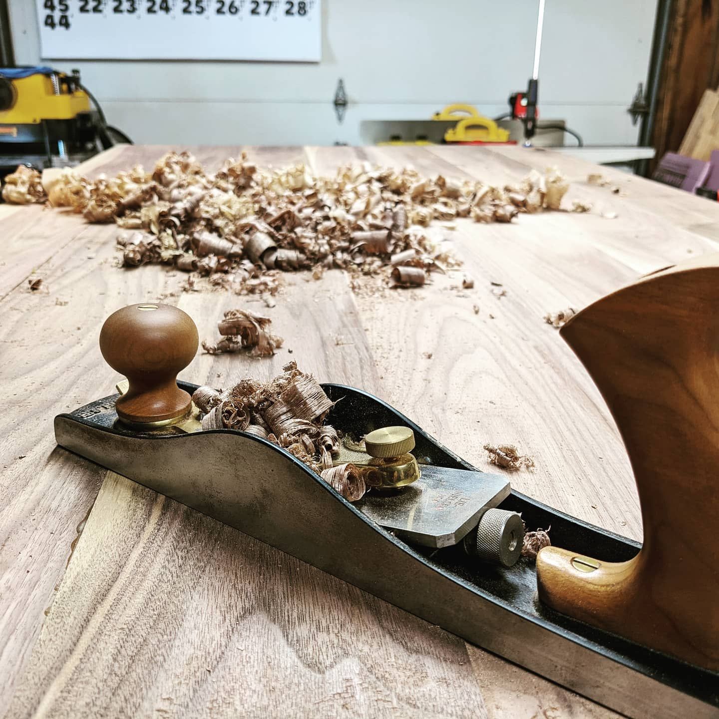 A plane is sitting on top of a wooden table