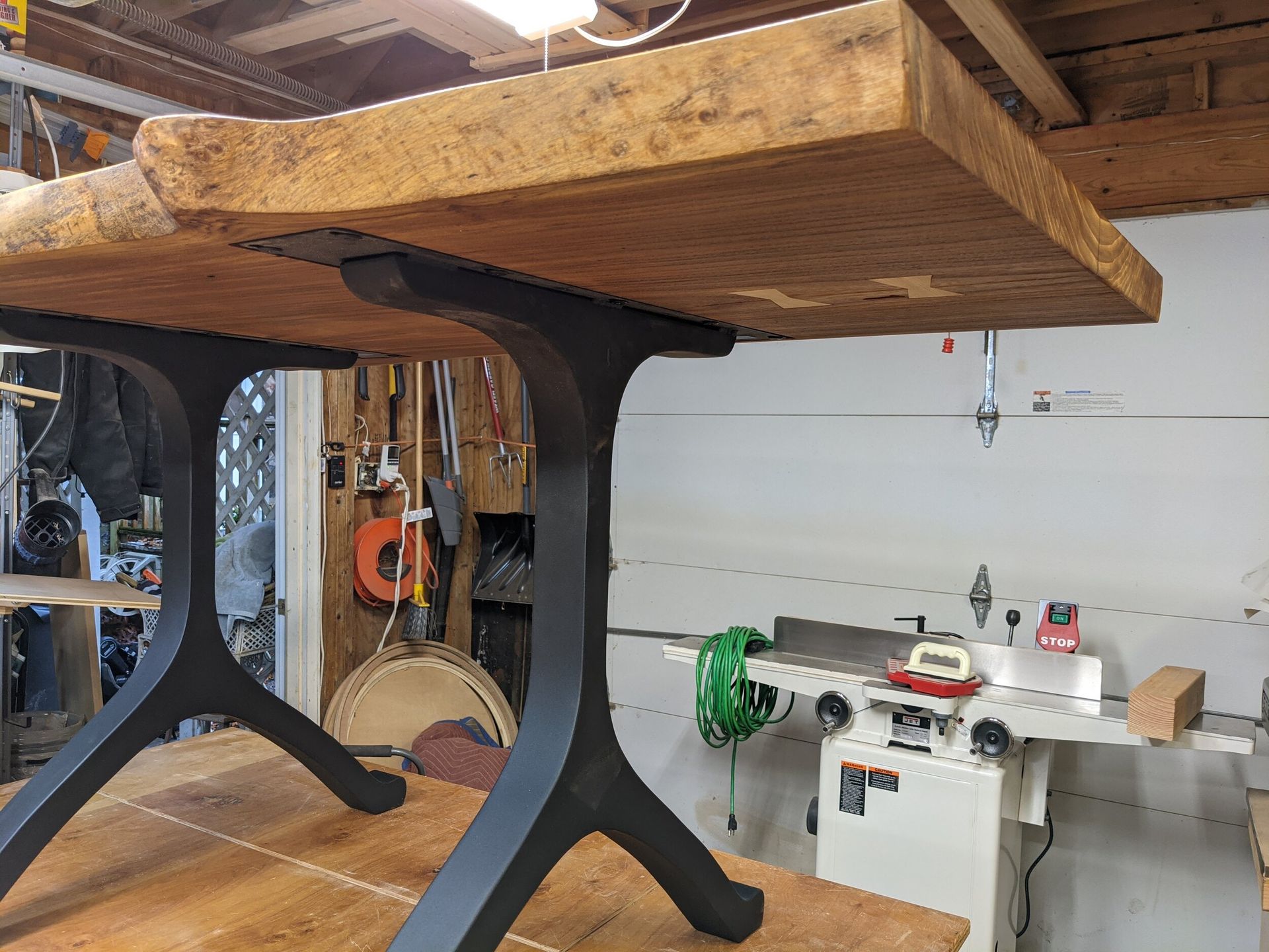 A wooden table is sitting on top of a wooden table in a workshop.