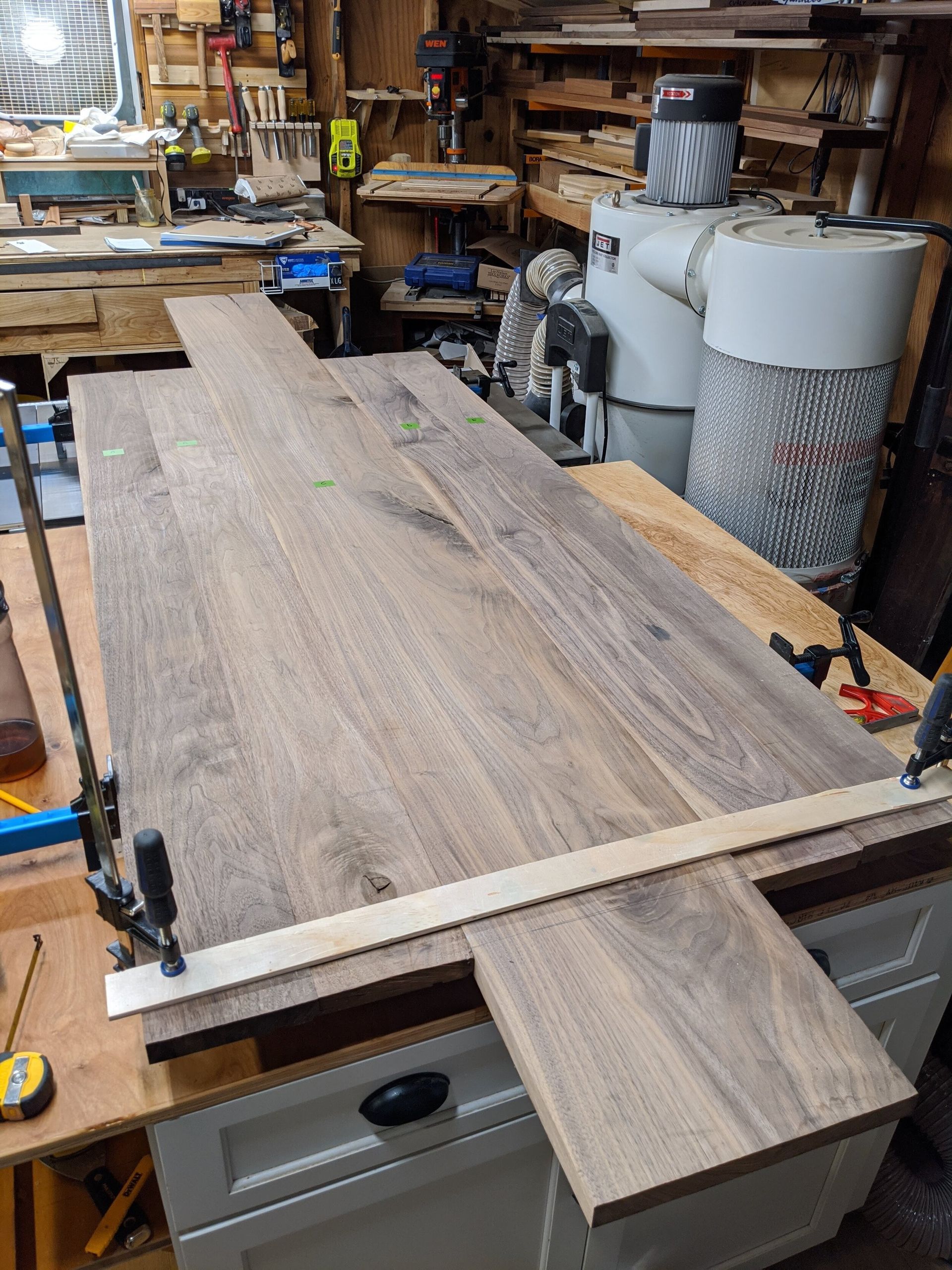 A piece of wood is sitting on top of a table in a workshop.