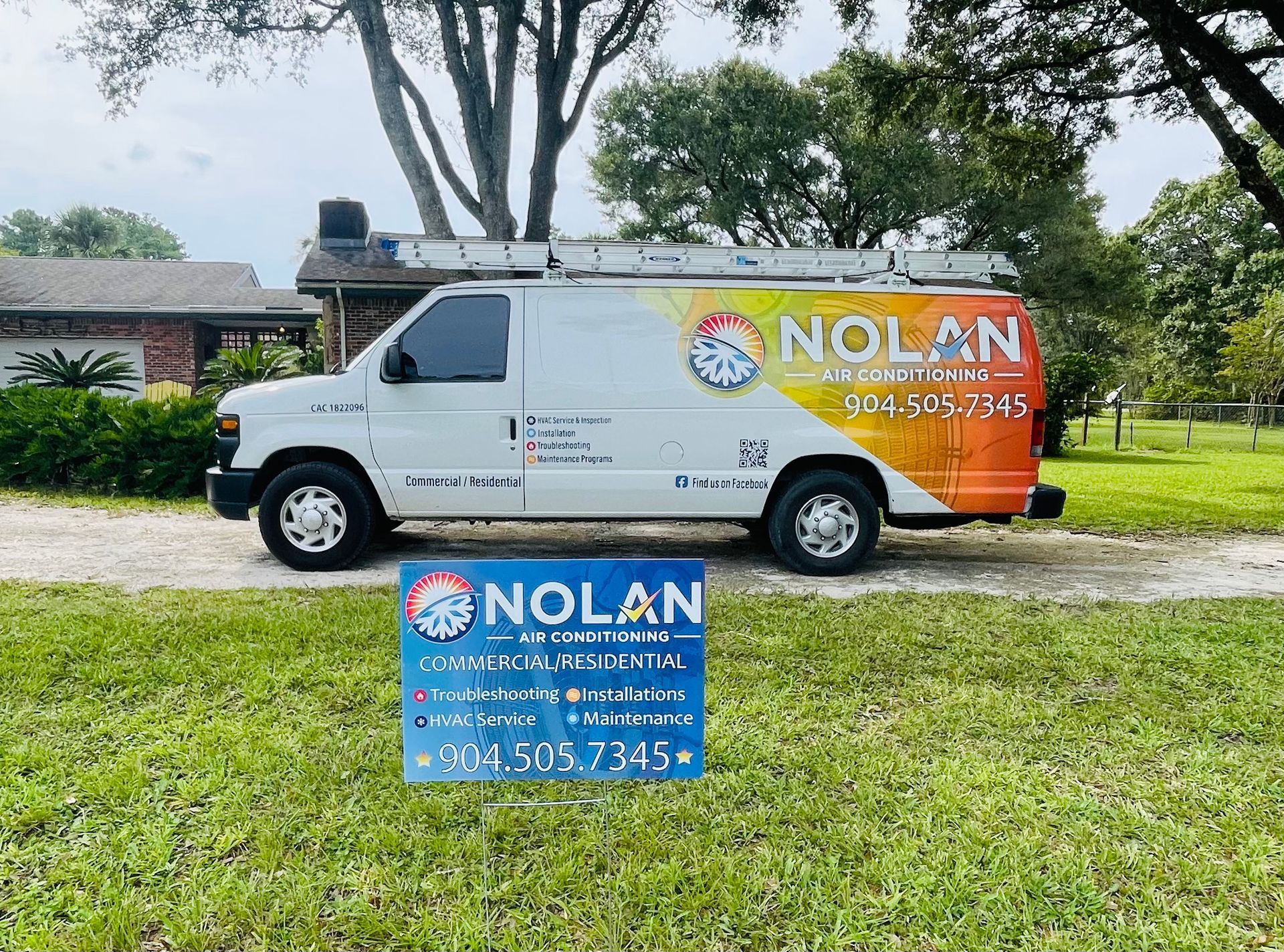 A nolan van is parked in front of a house.