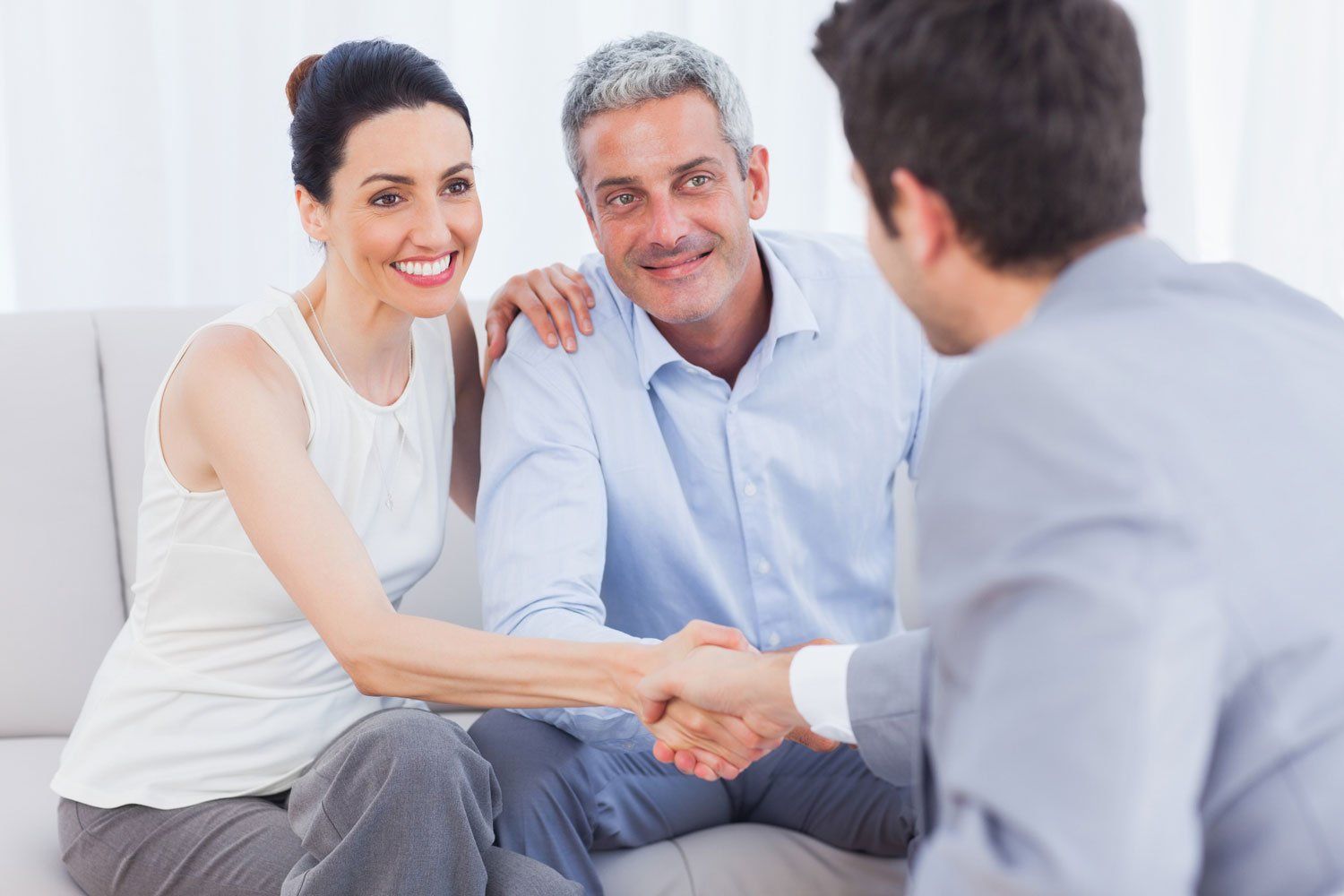 Commercial Real Estate — Couple Shaking Hands with Agent in Richmond, VA