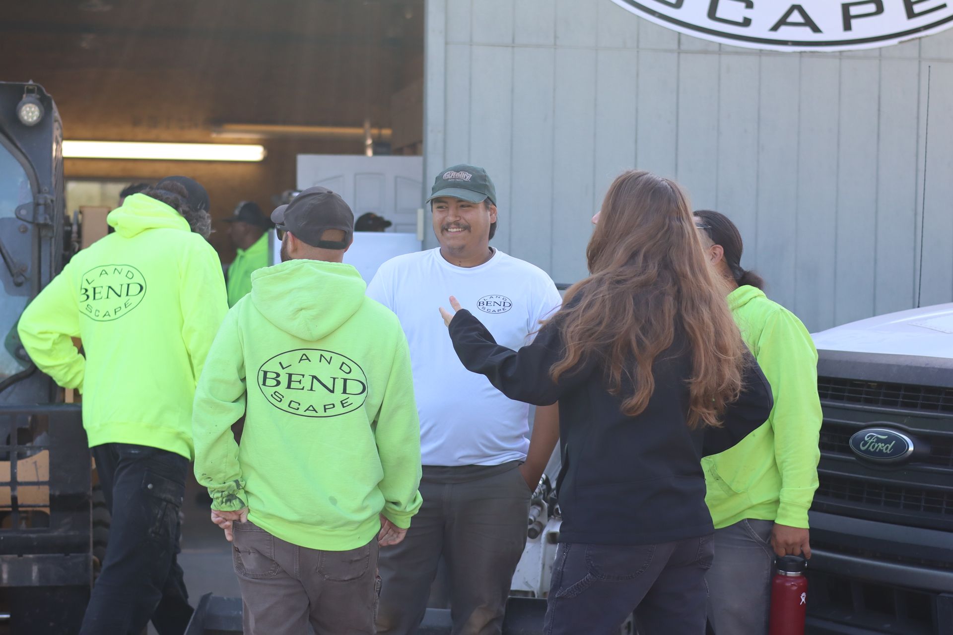 Group of people in casual wear and lime green hoodies with 