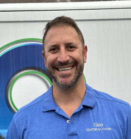 A man wearing a blue shirt that says geo heating & cooling