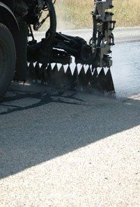 Commercial Paver — Truck Paving Road in Denver, CO Commercial Paver — Truck Paving Road in Denver, CO