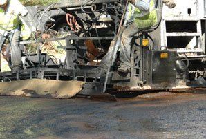 Asphalt Maintenance — Man On The Truck Smoothing The Road in Denver, CO