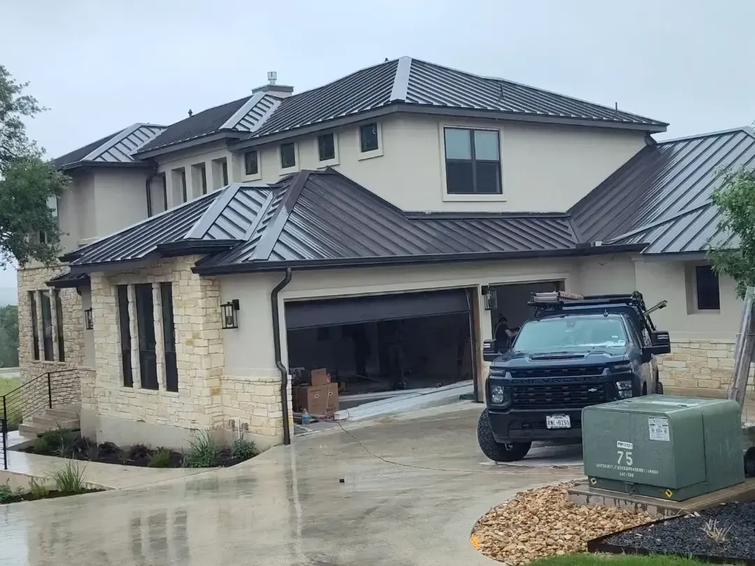 A large house with a car parked in front of it.