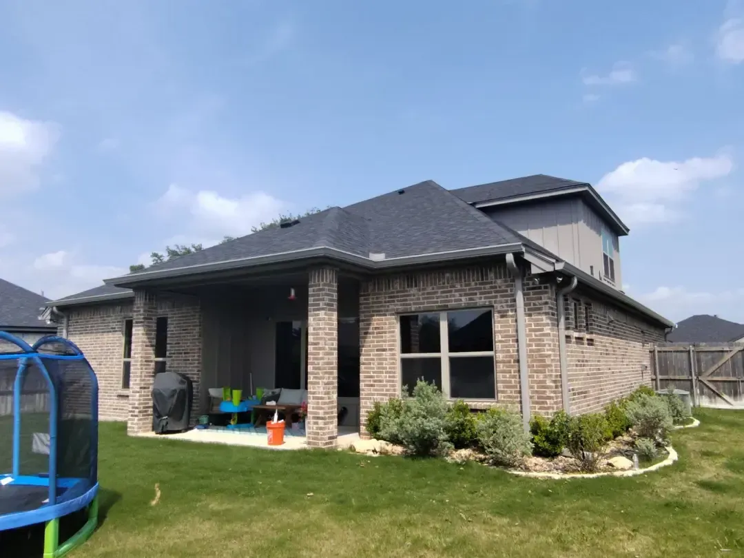 A house with a trampoline in front of it