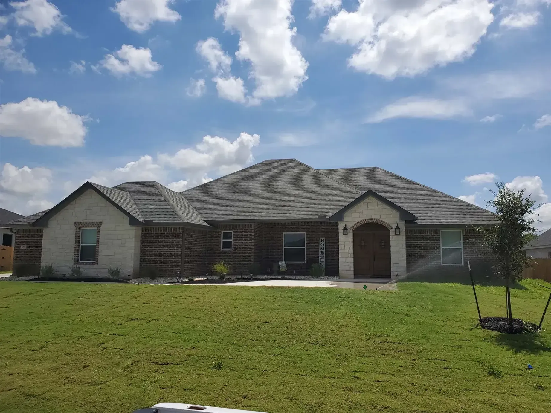 A large house with a lot of grass in front of it