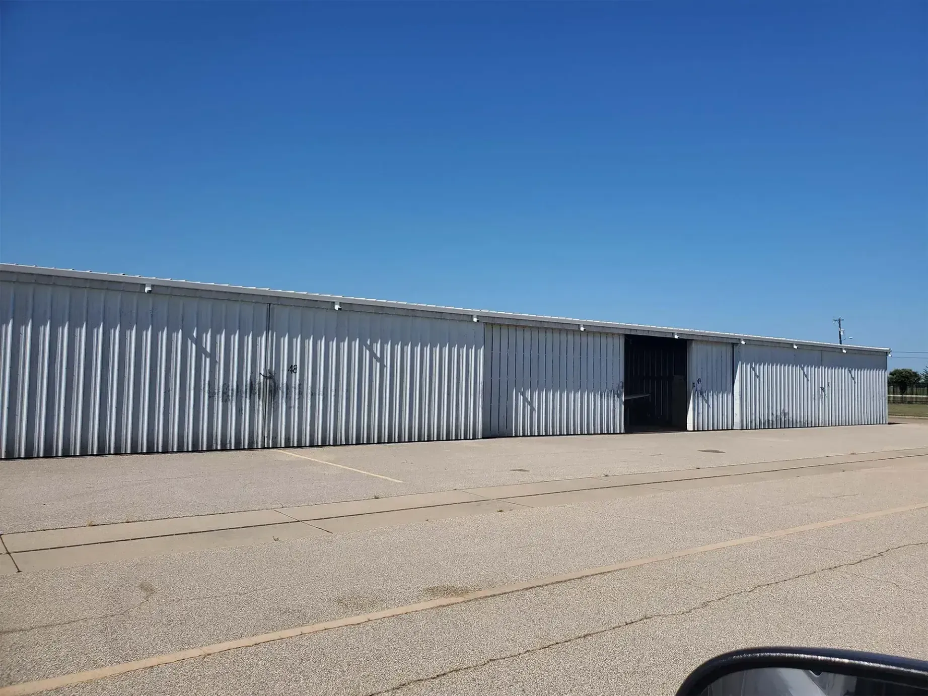 A large building with a blue sky in the background