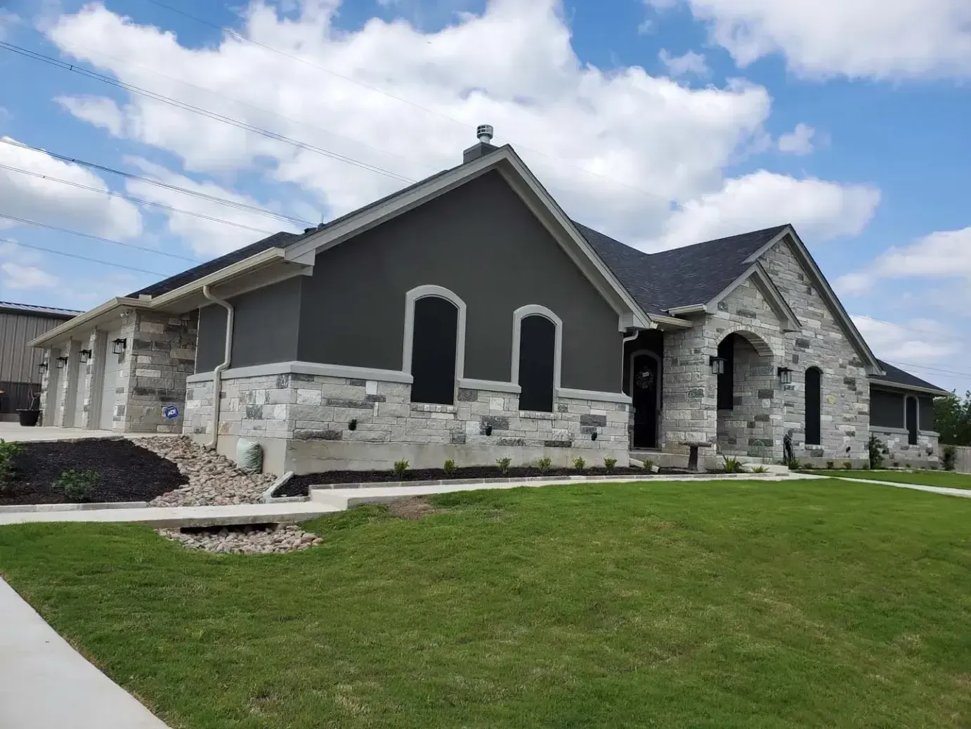 A large house with a large lawn in front of it