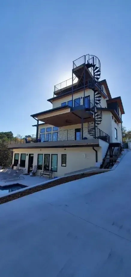 A large house with a fire escape on the side of it.