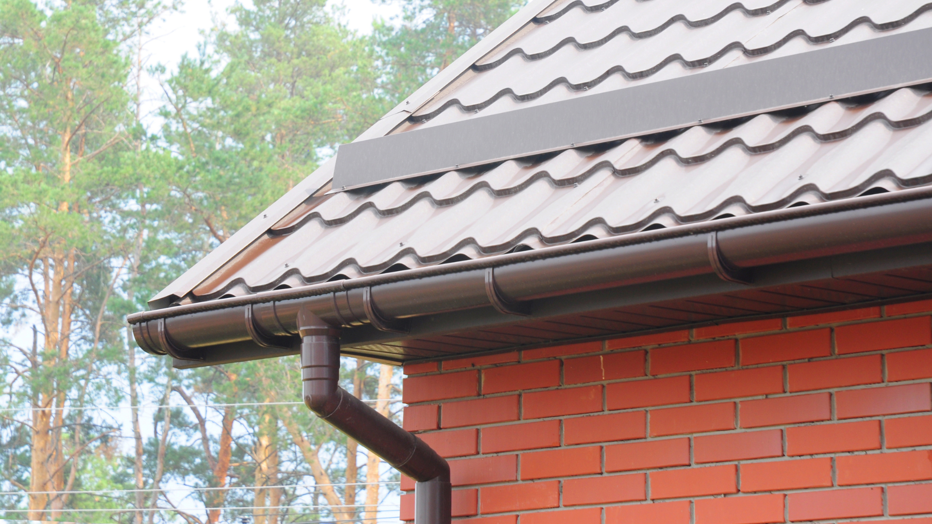 The right color - Empty room with wood cabinets, dark floors, and a black chair.
