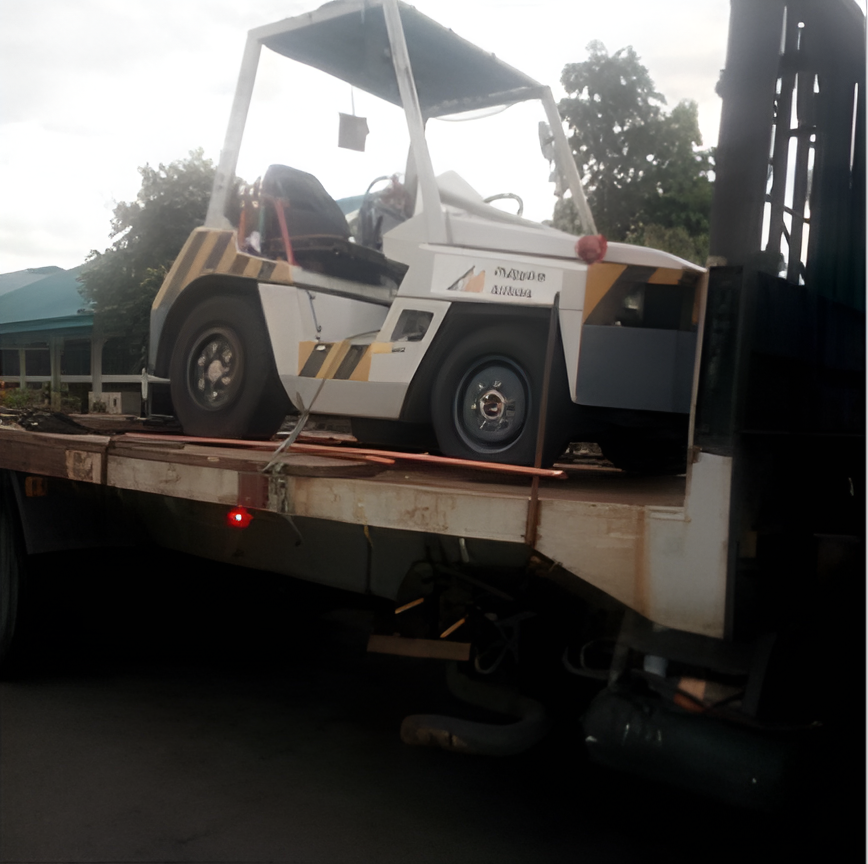 A White Forklift on A Flatbed Truck — Kerubin Logistics Inc in the Philippines