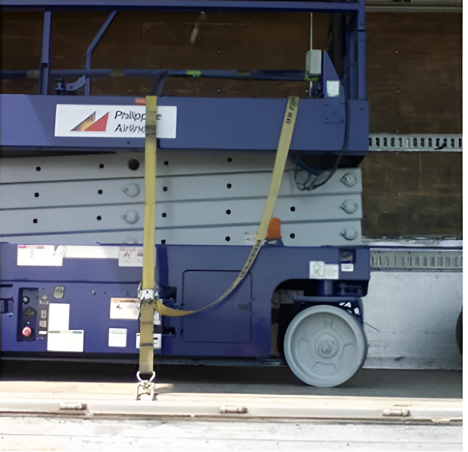 Blue Scissor Lift with Safety Straps on A Trailer — Kerubin Logistics Inc in the Philippines