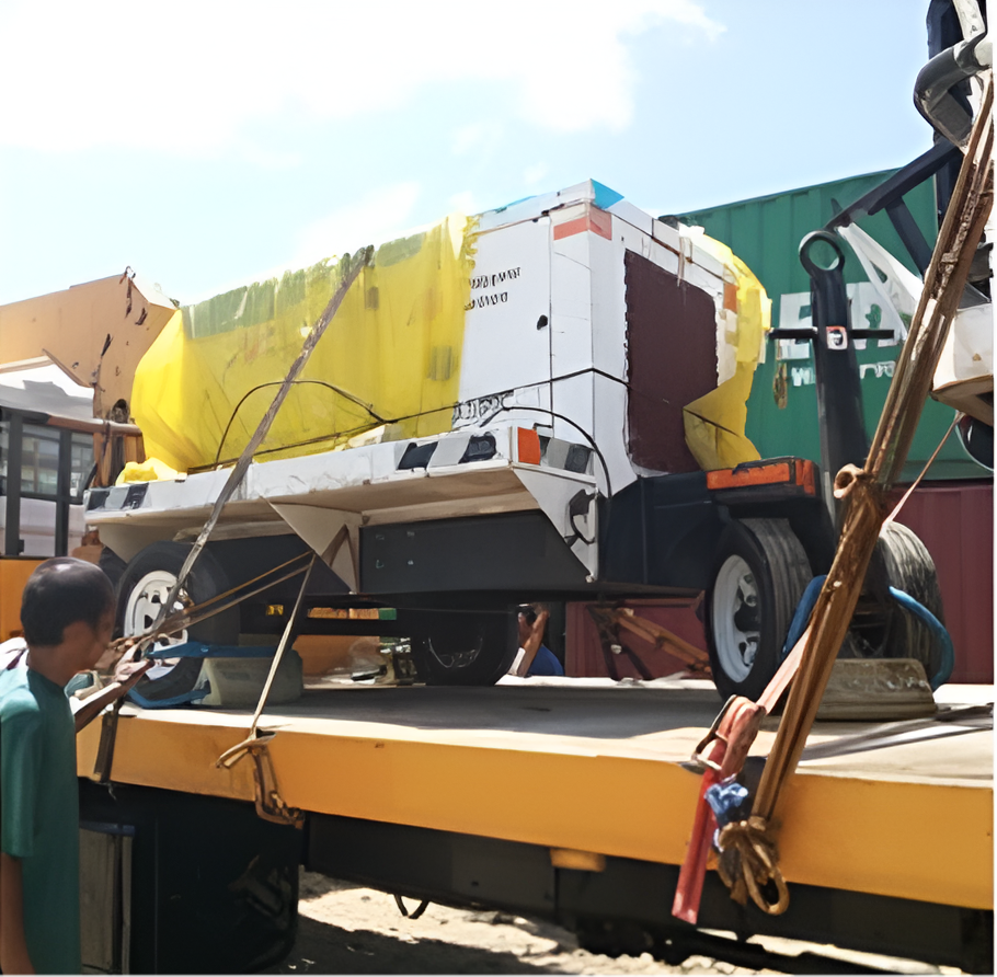 A White Generator on A Flatbed Truck, Secured with Straps — Kerubin Logistics Inc in the Philippines