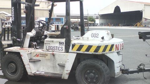 White Nissan Forklift with 