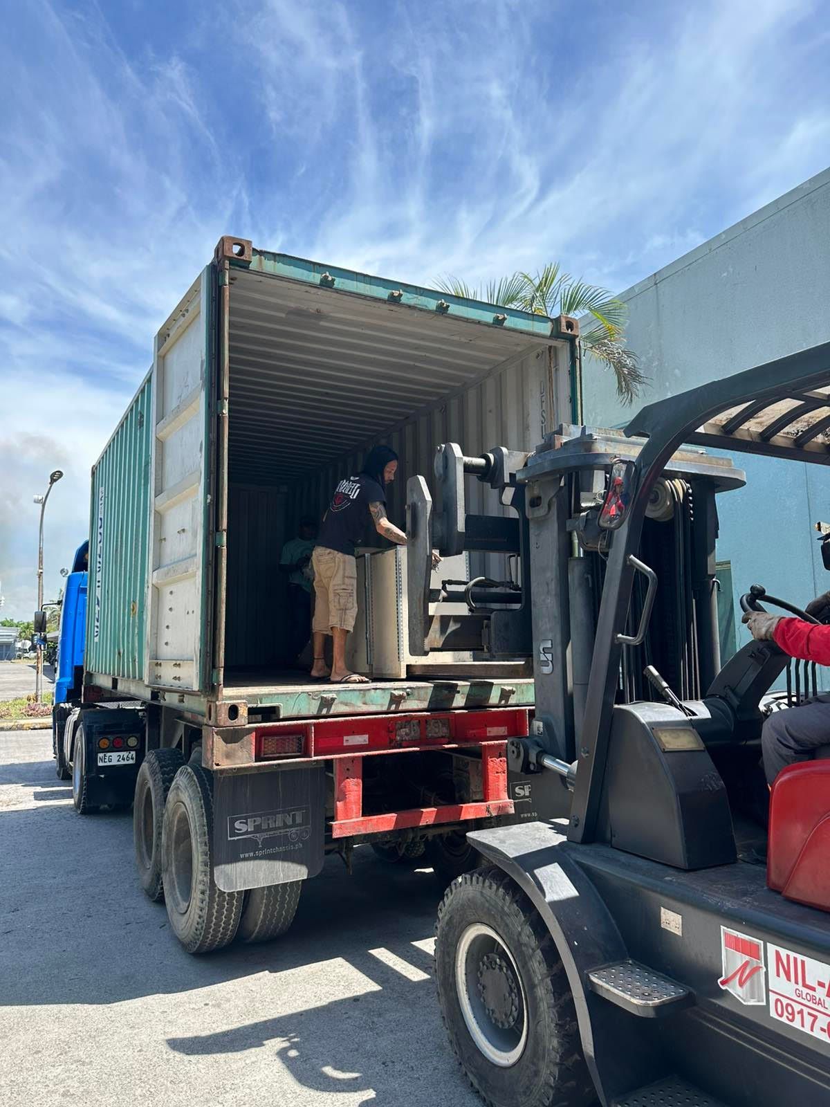 Forklift Loading a Container on A Truck. Man Inside the Container — Kerubin Logistics Inc in the Philippines