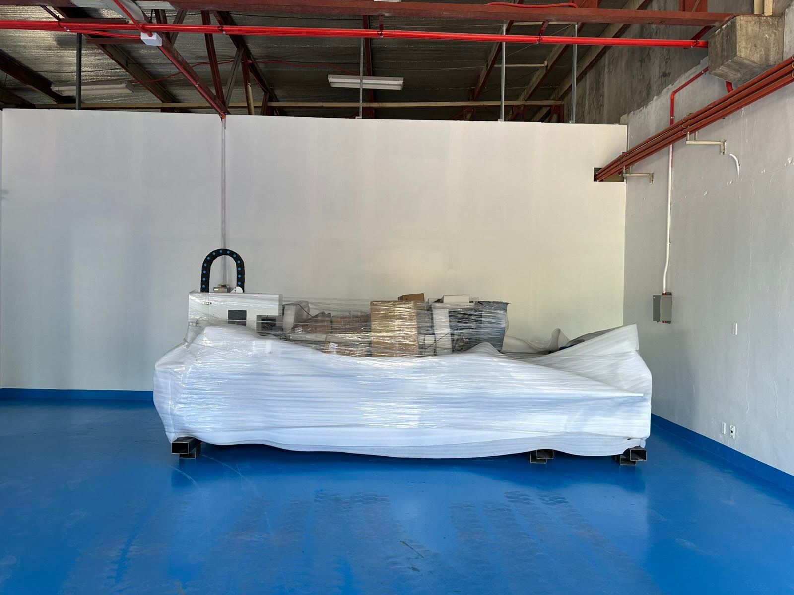 Machine Wrapped in Plastic in A Warehouse — Kerubin Logistics Inc in the Philippines