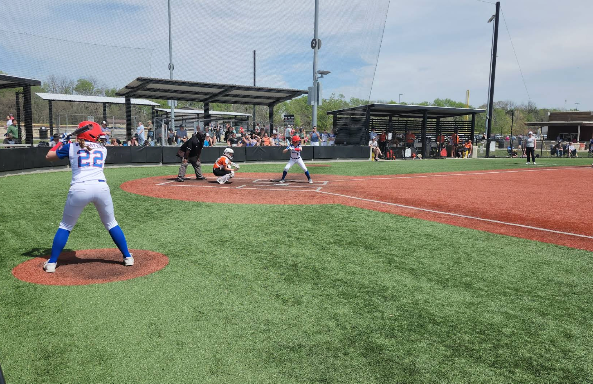 A baseball game is being played on a baseball field.