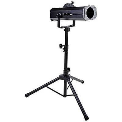 A projector is sitting on top of a tripod on a white background.