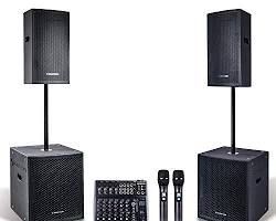 A pair of speakers , a subwoofer , a mixer , and two microphones.