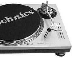 A black and white photo of a technics turntable.