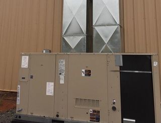 Man Checking Air Conditioner — HVAC in Spartanburg, SC
