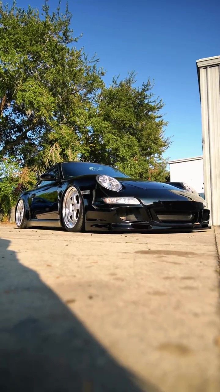 Black Porsche 911 after days of professional detailing services.