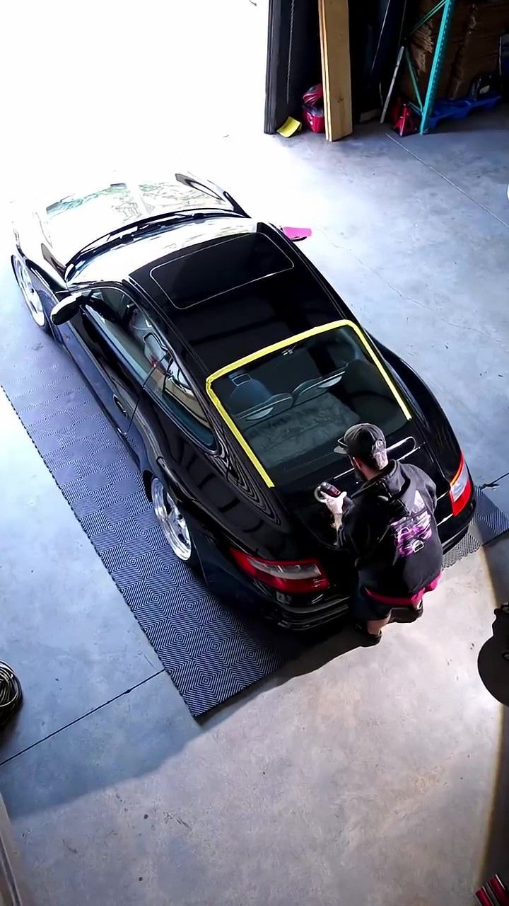 K&N Detailing polishing a black Porsche 911 in Orlando, Florida.