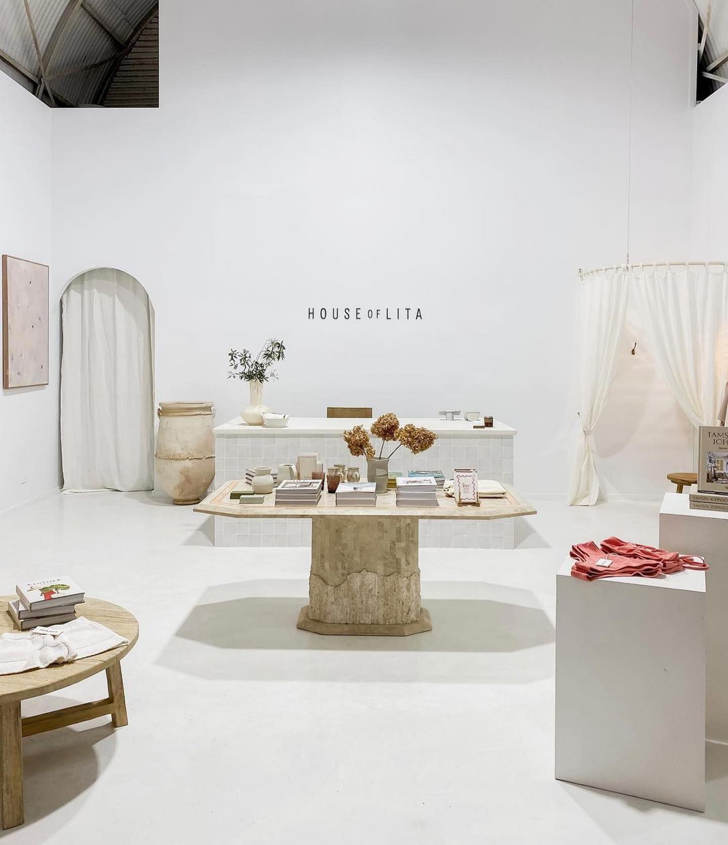 There is a table in the middle of the room.