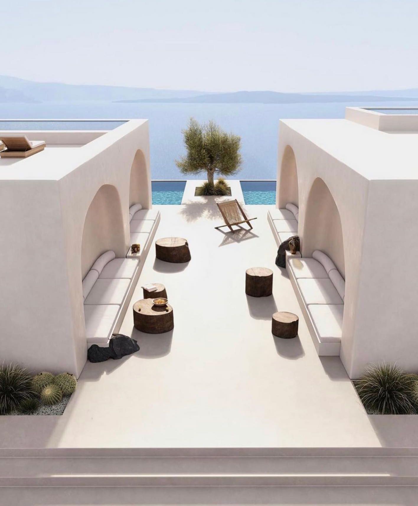 A white building with a view of the ocean