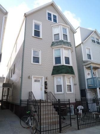 A house with a bicycle parked in front of it