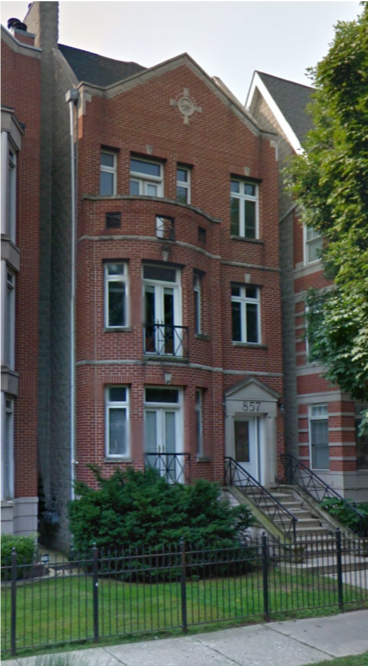 A large brick building with a cross on it