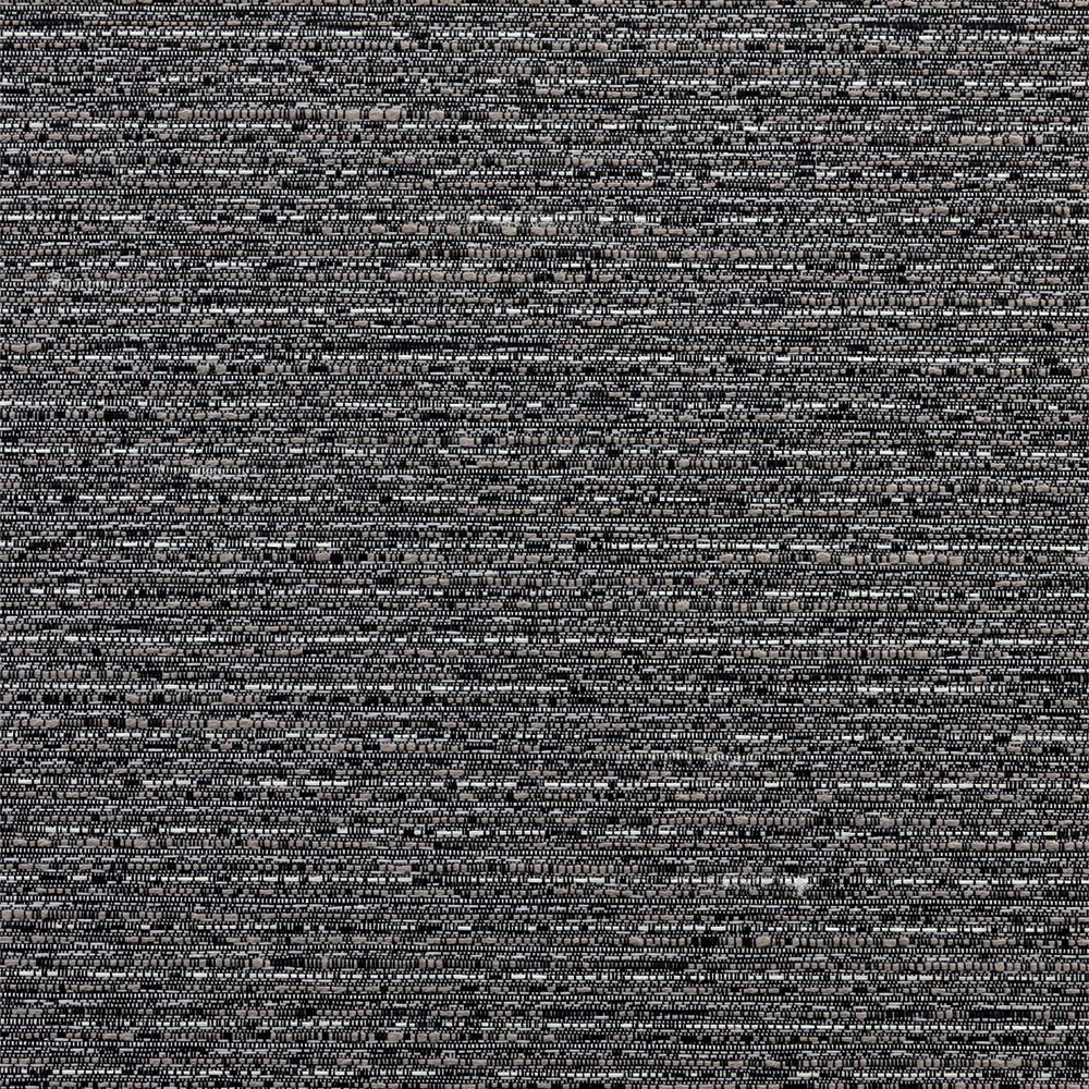 The sun is shining through a metal fence