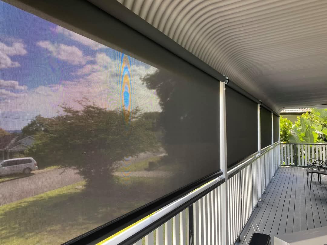 A porch with a lot of blinds on it.